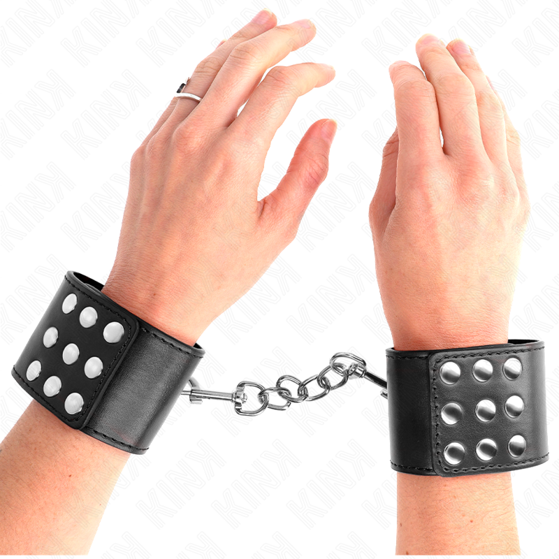 KINK - Handledsresårer med tryckknapp svart justerbar 19-24 cm x 5,5 cm
